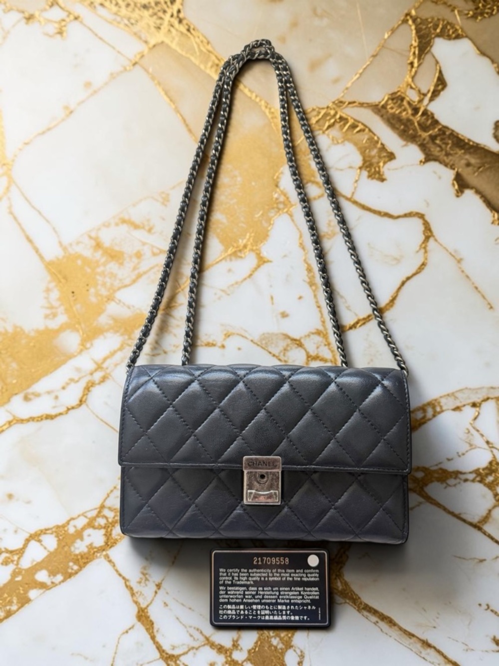 CHANEL Black Quilted Lambskin Crossbody with Silver Chain